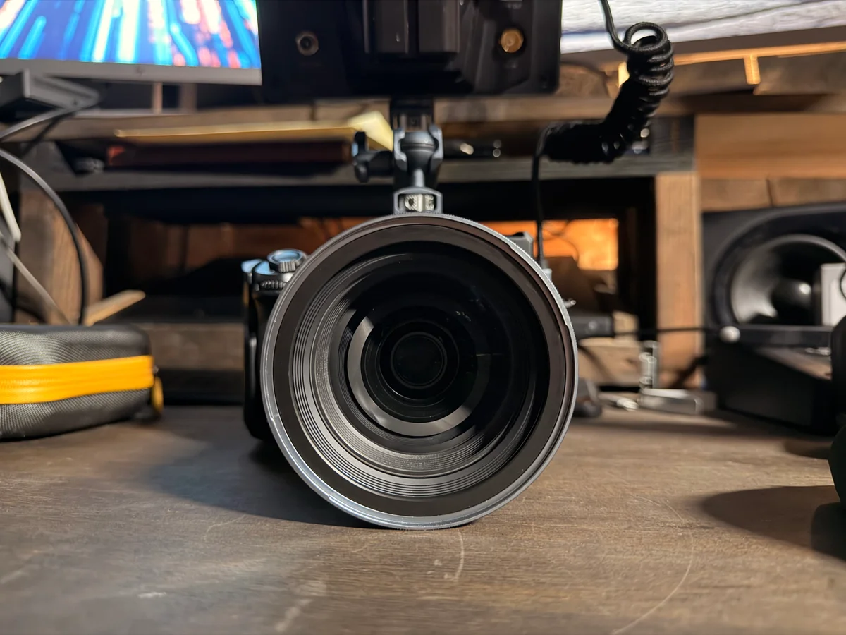 John’s camera and monitor on a studio desk, with the lens facing forward